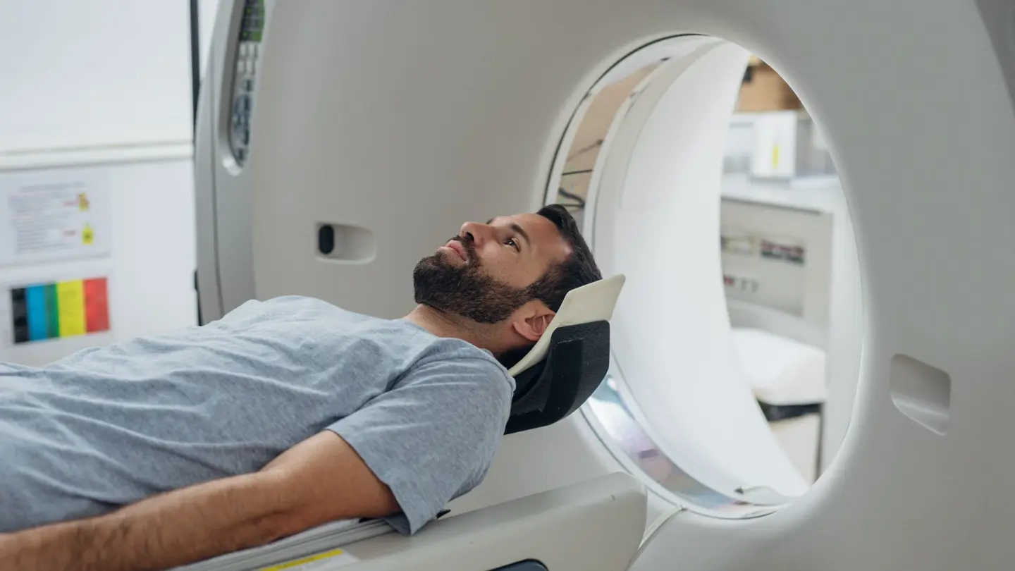 Patient Lying On The CT Scanner